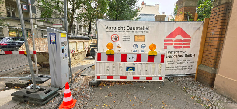 Berlin, Germany - September 22, 2025: Construction site with warning signs and barriers in urban setting