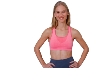 Young healthy woman smiling after fitness workout, standing confident with hands on hips, transparent background