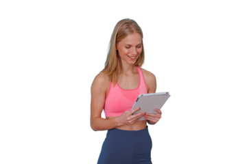 Woman wearing sportswear, smiling and looking at a digital tablet, planning her fitness routine. Transparent background