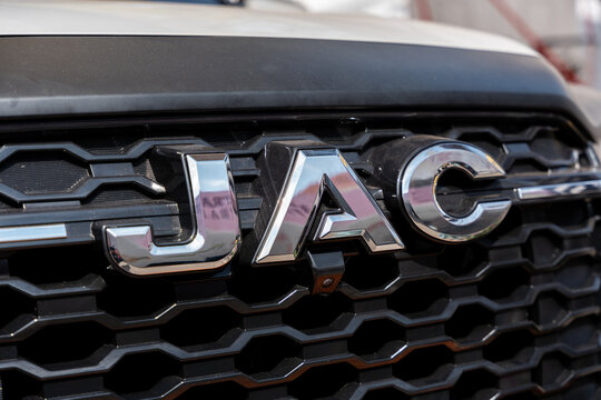 Silver emblem of the Chinese brand JAC (owned by JAC Motors) centered on the front grille of one of its trucks. Jalisco, Mexico, Nov. 10, 2025.