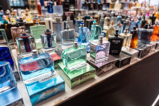 Counterfeit perfumes and fake goods displayed and stacked for sale in a street market or vendor stall in Silk Street Market (Xiushui Market), Beijing, China. Nov. 2, 2025. Lacoste