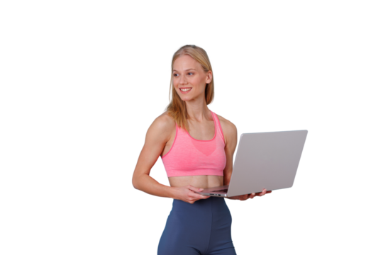 Woman working on laptop while smiling, wearing sportswear and looking away, fitness tracking concept with transparent background
