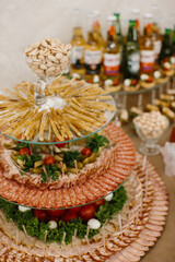 Buffet table serving cold cuts and savory snacks