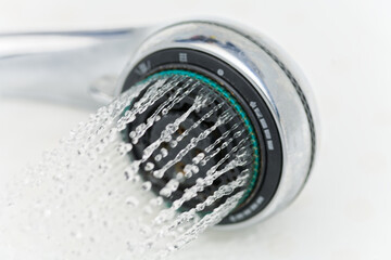 Modern Rain Shower Head Releasing High-Pressure Water Streams