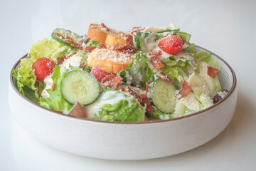 Caesar Salad: Crisp romaine lettuce tossed with Parmesan, croutons, and a creamy Caesar dressing,