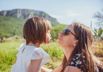 A mother and a daughter bonding in nature
