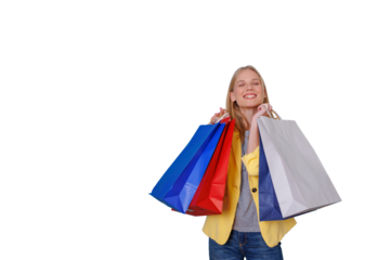 Happy woman carrying shopping bags, smiling and showing excitement after a successful retail therapy experience. Transparent background