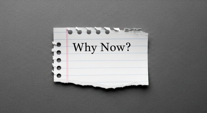 Torn lined paper with 'Why Now?' text on a dark textured background, questioning urgency
