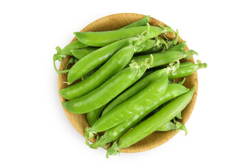 Fresh green peas fresh peas in pods in a wooden bowl isolated on white background. Top view. Flat lay