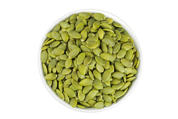 Peeled pumpkin seeds in ceramic bowl isolated on white background. Top view. Flat lay