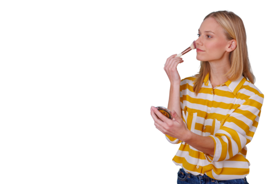 Young woman applying makeup powder with a brush, doing beauty routine for skincare, personal grooming and self-care on transparent background