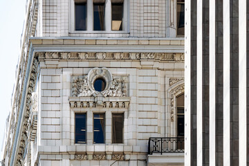Ornate white-stone facade detail of a historic building on Place d’Armes, Old Montreal