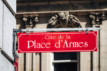 Montreal, Canada - August 11, 2025: Red street sign for Cote de la Place d'Armes in Old Montreal near the historic square and Notre Dame Basilica
