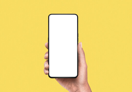 Close-up of hand holding modern smartphone with blank screen isolated on white background. High quality studio shot. Concept for technology, business, finance, advertising and public relations.
