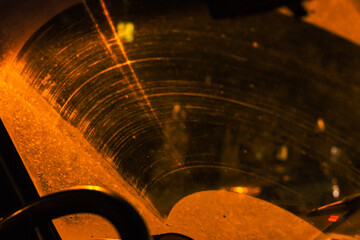 Blurred image of a dirty windshield, the background is blurred with a bokeh effect