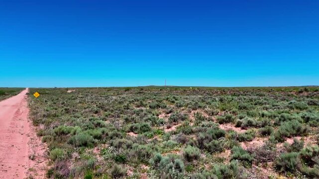 Aerial landscape of rural desert road in summer historic US route 66 San Jon New Mexico NM