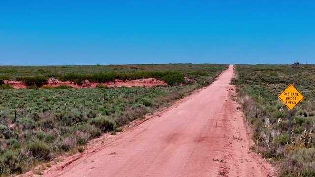 Aerial landscape of rural desert road in summer historic US route 66 San Jon New Mexico NM