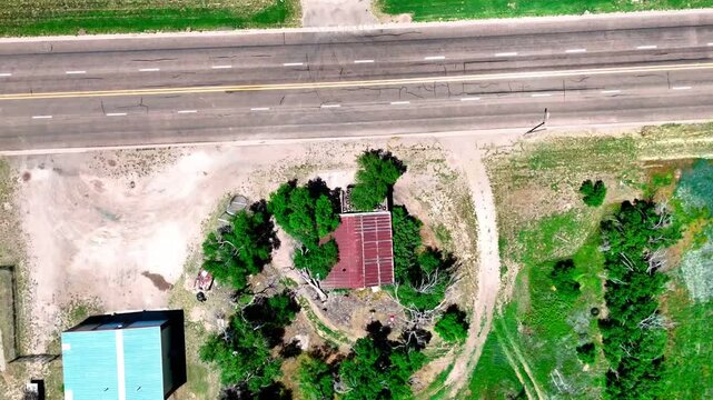 Aerial top down of small rural desert town in summer historic US route 66 San Jon New Mexico NM