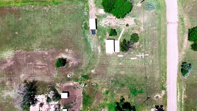 Aerial top down of small rural desert town in summer historic US route 66 San Jon New Mexico NM