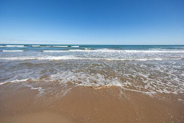 Gandia beach sea waves coming to shore