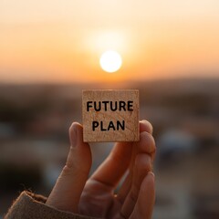 Future Plan Sign Held in Hand, Outdoor Setting, Inspirational Content, Vibrant Environment