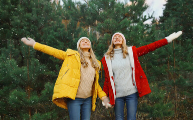 Happy smiling women friends having fun, celebration, joyful girlfriends together on Christmas tree
