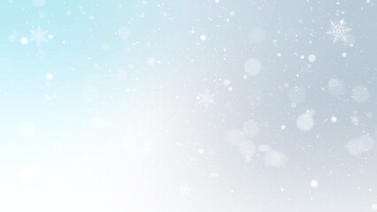 Winter holiday background featuring soft snowflakes, small particles, and bokeh circles on a very light blue to white gentle gradient