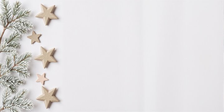 Christmas decoration with wooden stars and pine branches on a white background