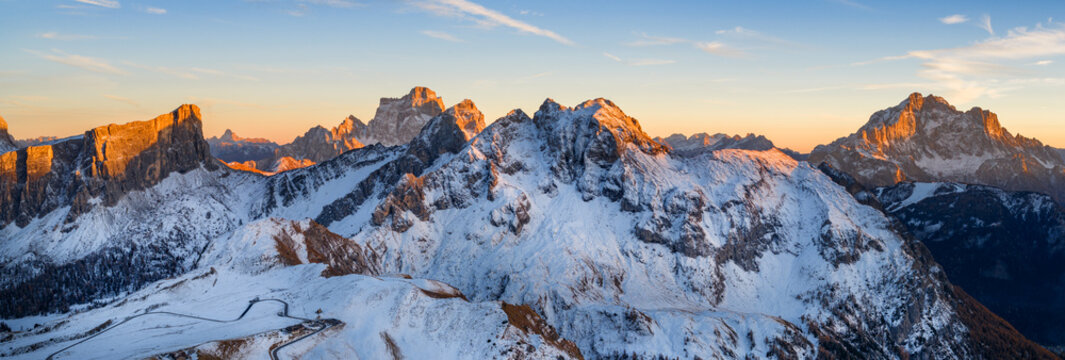 Panorama of the Dolomites mountains during autumn sunrise. Beautiful mountians of Alpi Dolomiti in Italy, South Tirol