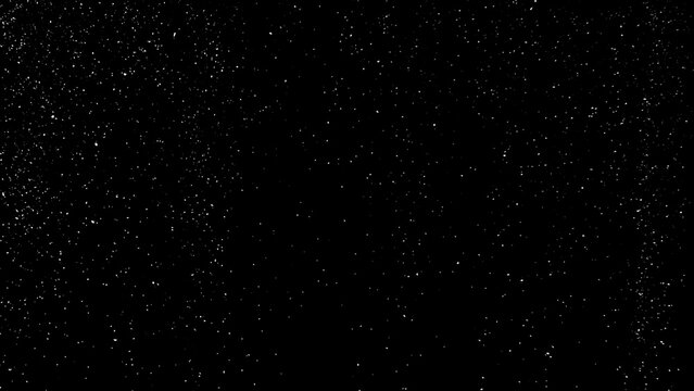 Freeze motion of natural snow falling on black background