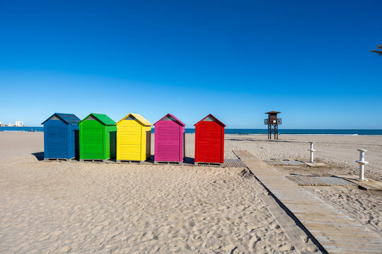 Colorful beach huts lining cullera sand beach