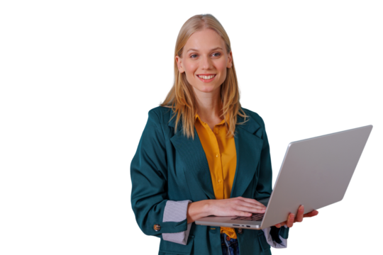 Woman holding and typing on a laptop, smiling at the camera, showing confidence and professionalism in a modern work environment