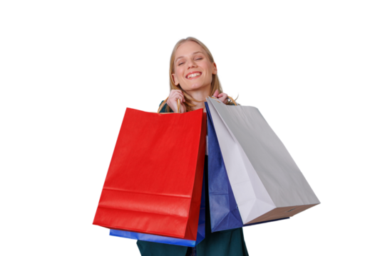 Young woman smiling with closed eyes, holding colorful shopping bags after successful retail therapy, transparent background