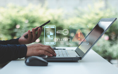 Hand using laptop and smartphone with 2 step verification for identity identification, multi factor authentication, information secure encryption. Cyber crime and cyber security alert warning concept.