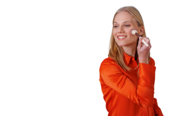Woman applying blush with makeup brush, smiling during beauty routine, self-care concept with transparent background
