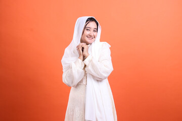 Radiant Serenity, A smiling woman showcases grace in white attir