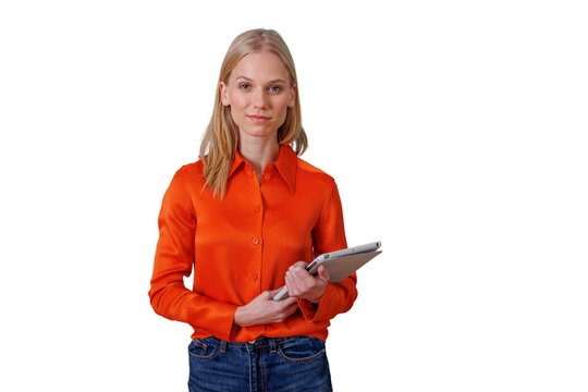 Young businesswoman standing carrying a tablet, looking forward with focus. Woman showing modern technology for business