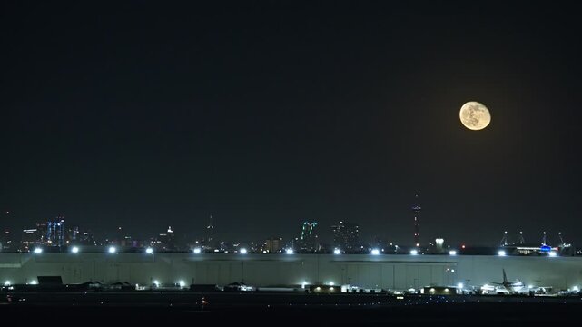 Military Fighter Jet Landing at Air Force Base with San Antonio Skyline and Full Moon