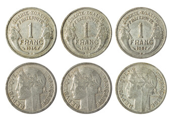 Isolated photo of 1 franc France 1946, 1947 and 1957 Fourth republic aluminum coin obverse and reverse on white background.