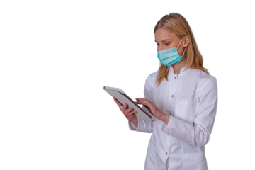 Medical professional wearing face mask and white coat, using digital tablet for healthcare data, transparent background
