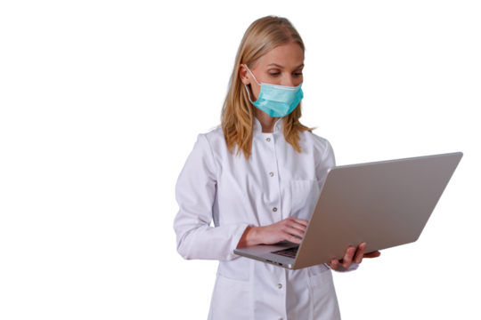 Medical professional wearing face mask and white coat collaborating with technology on a laptop, transparent background