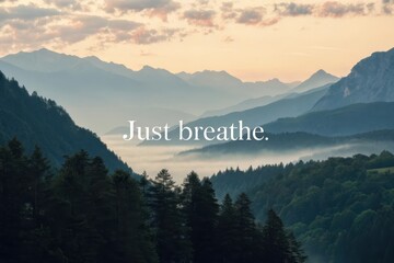 Inspiring landscape with mountains and the words Just Breathe