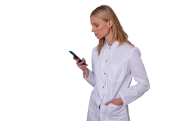 Medical professional standing, looking down at smartphone, using mobile app for healthcare technology data