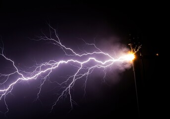 Intense electrical discharge creating a powerful, dangerous energy surge. Bright sparks illuminate a high voltage jolt of pure power ,technology ,industrial ,voltage