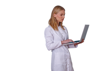 Female doctor in lab coat using laptop, working with medical technology and healthcare data