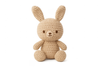 Hand knitted beige amigurumi rabbit toy on transparent
