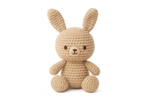 Hand knitted beige amigurumi rabbit toy on transparent