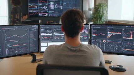 Medium shot of a data scientist monitoring realtime AI sentiment analysis on multiple screens in a modern tech office