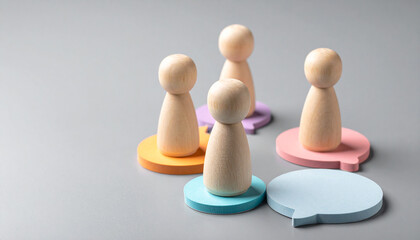 Conceptual representation of people communicating ideas on speech bubbles, symbolizing collaboration and discussion in a professional setting