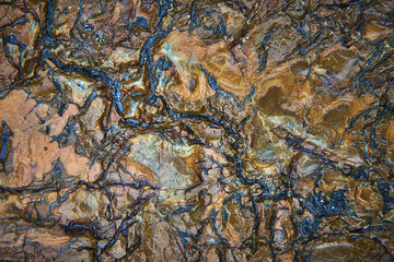 Abstract Rock Texture with Earth Tones and Natural Cracks Close Up